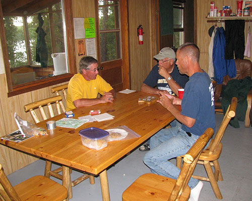 Relaxing playing cards inside Headwaters cabin