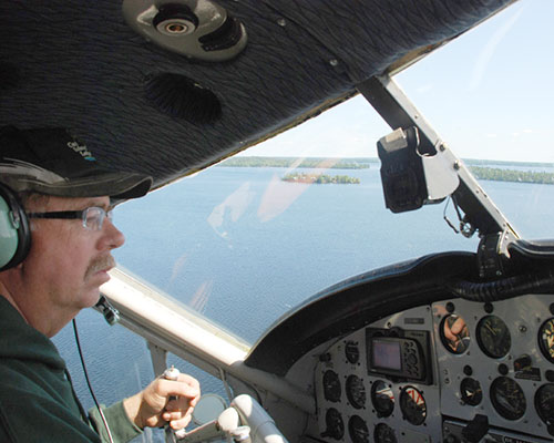 Faron Buckler prepares to land at Cat Island Lodge on Trout Lake